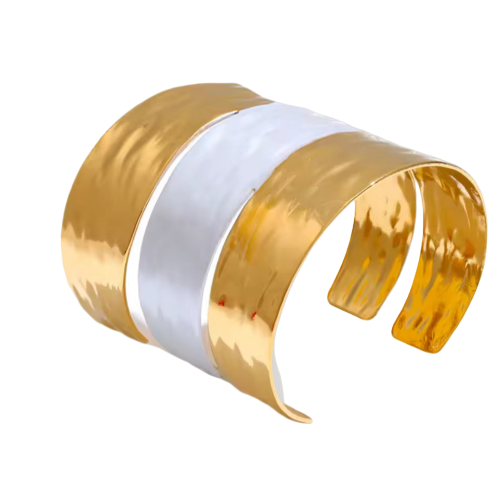 Gold and white cuff bracelet on a light gray background