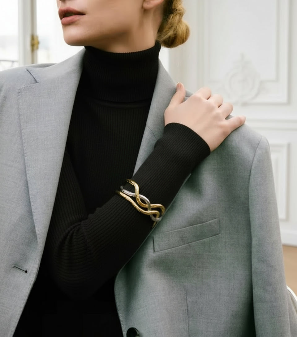 model wearing a gold and silver cuff