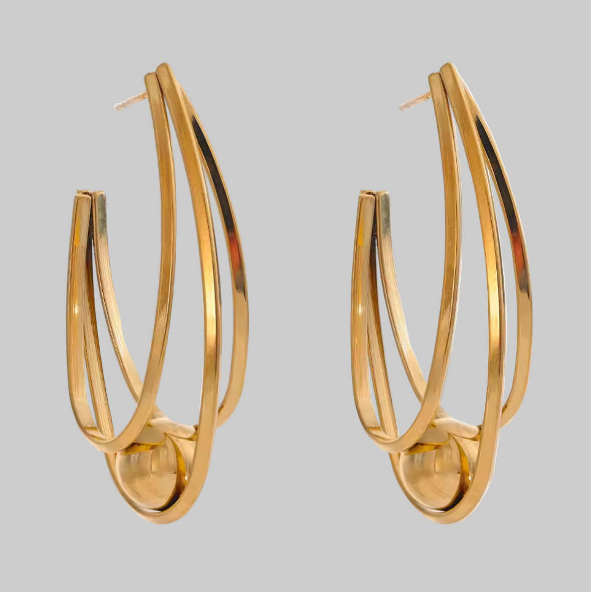 Gold hoop earrings on a white background